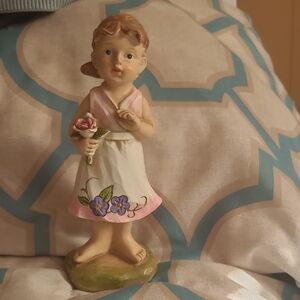 Charming Figurine with Pink and Purple Accents